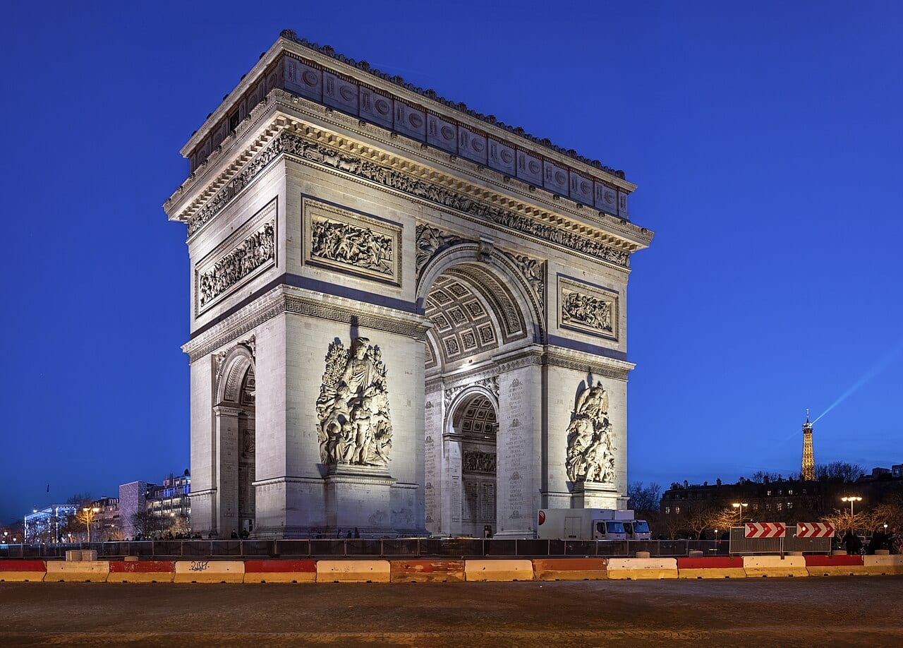 The Arc de Triomphe at night in Paris, France