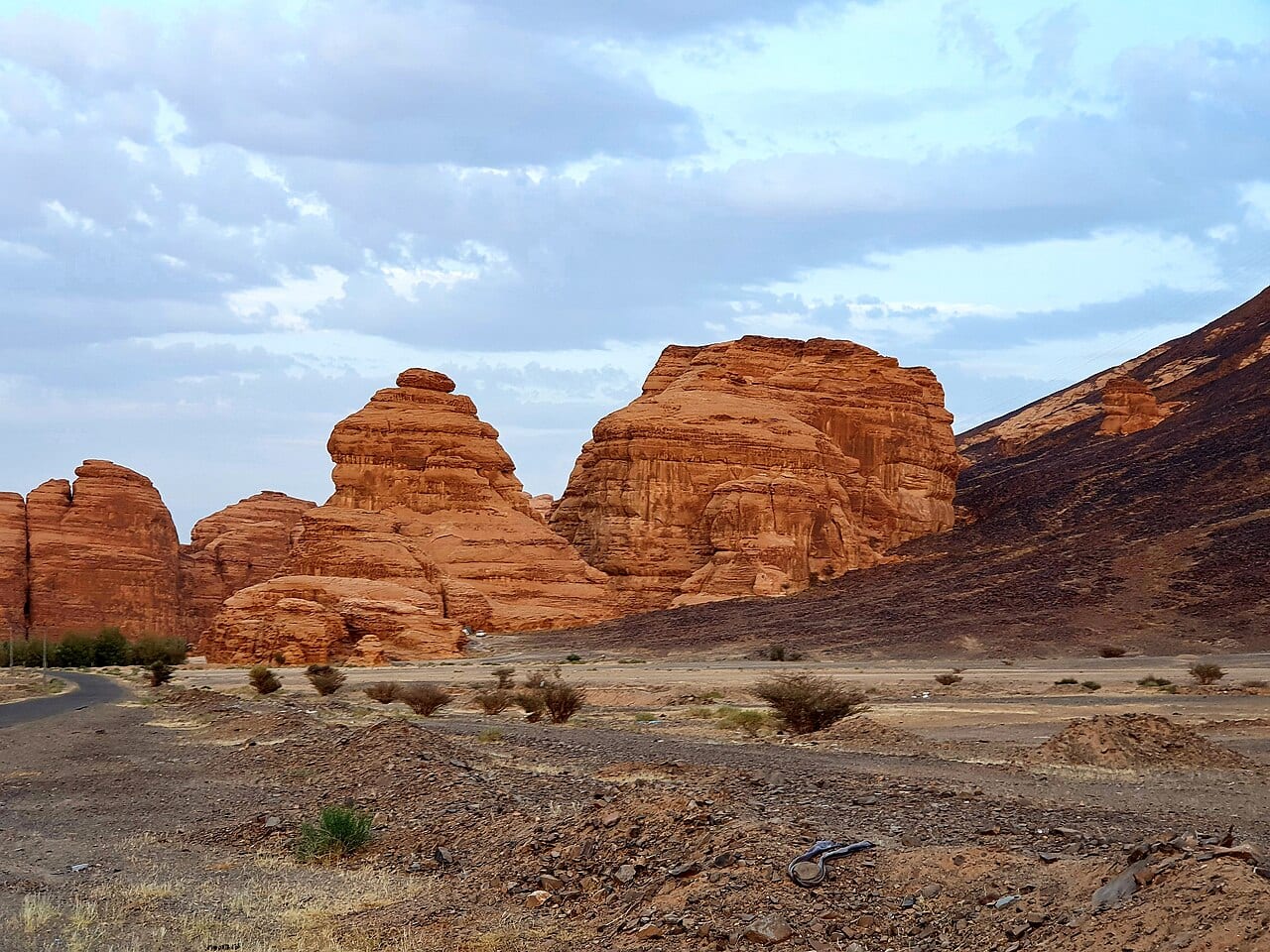Wind-carved sandstone outcrops in the desert around AlUla