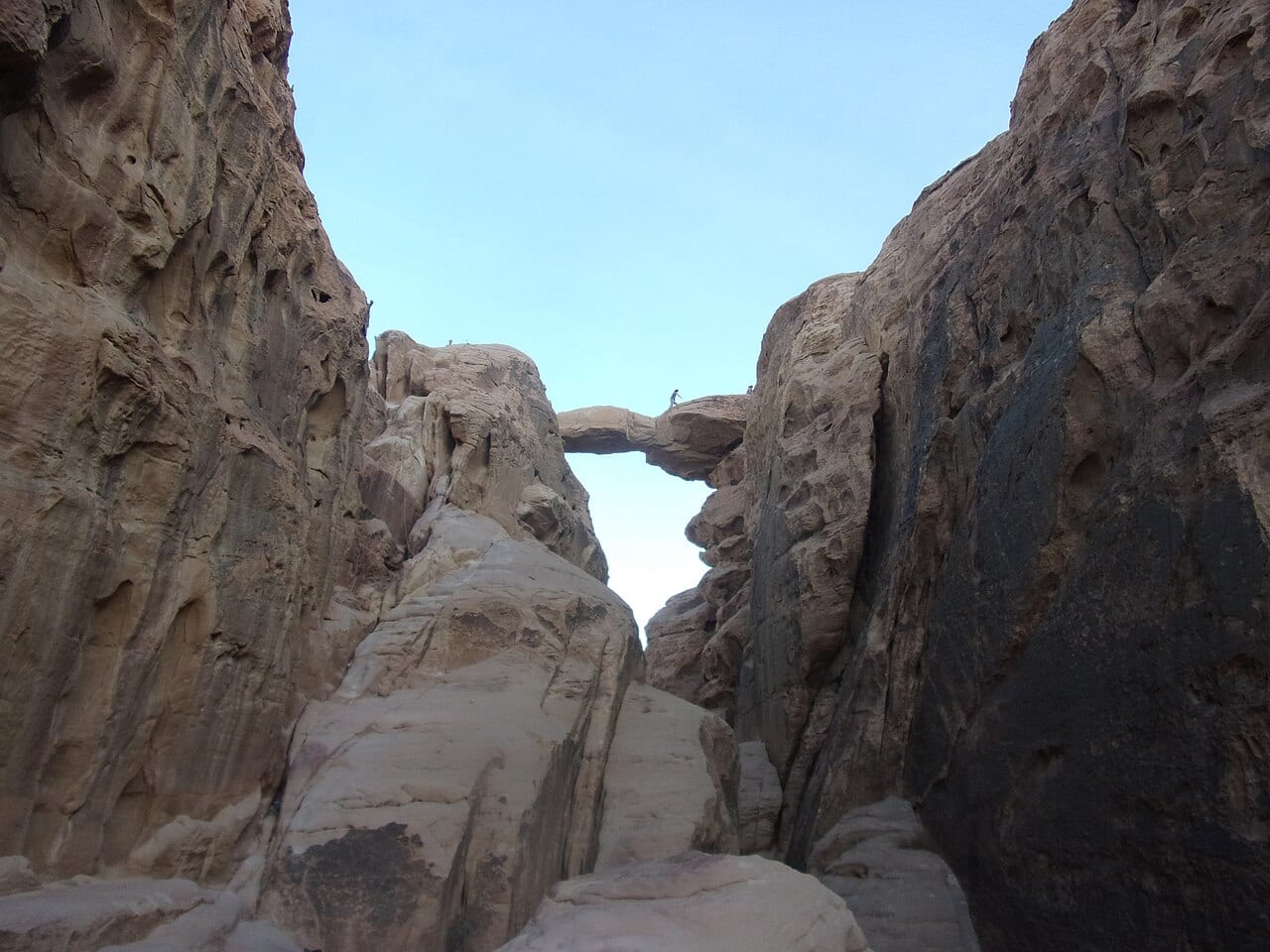Burdah rock bridge, a natural stone arch high on a mountain in Wadi Rum