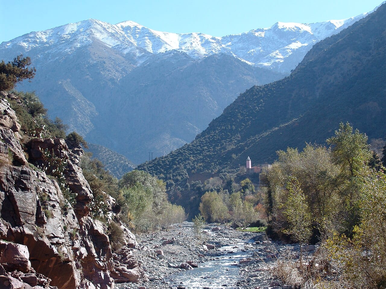 A river valley in the High Atlas with snow-capped peaks near Marrakech