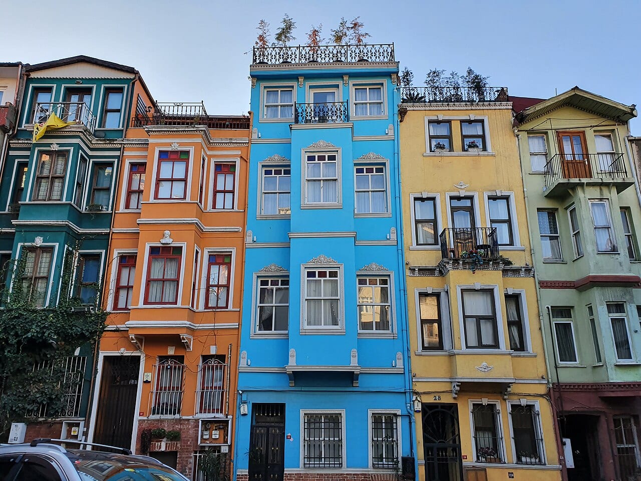 Colourful old wooden and stone houses on a steep street in Balat