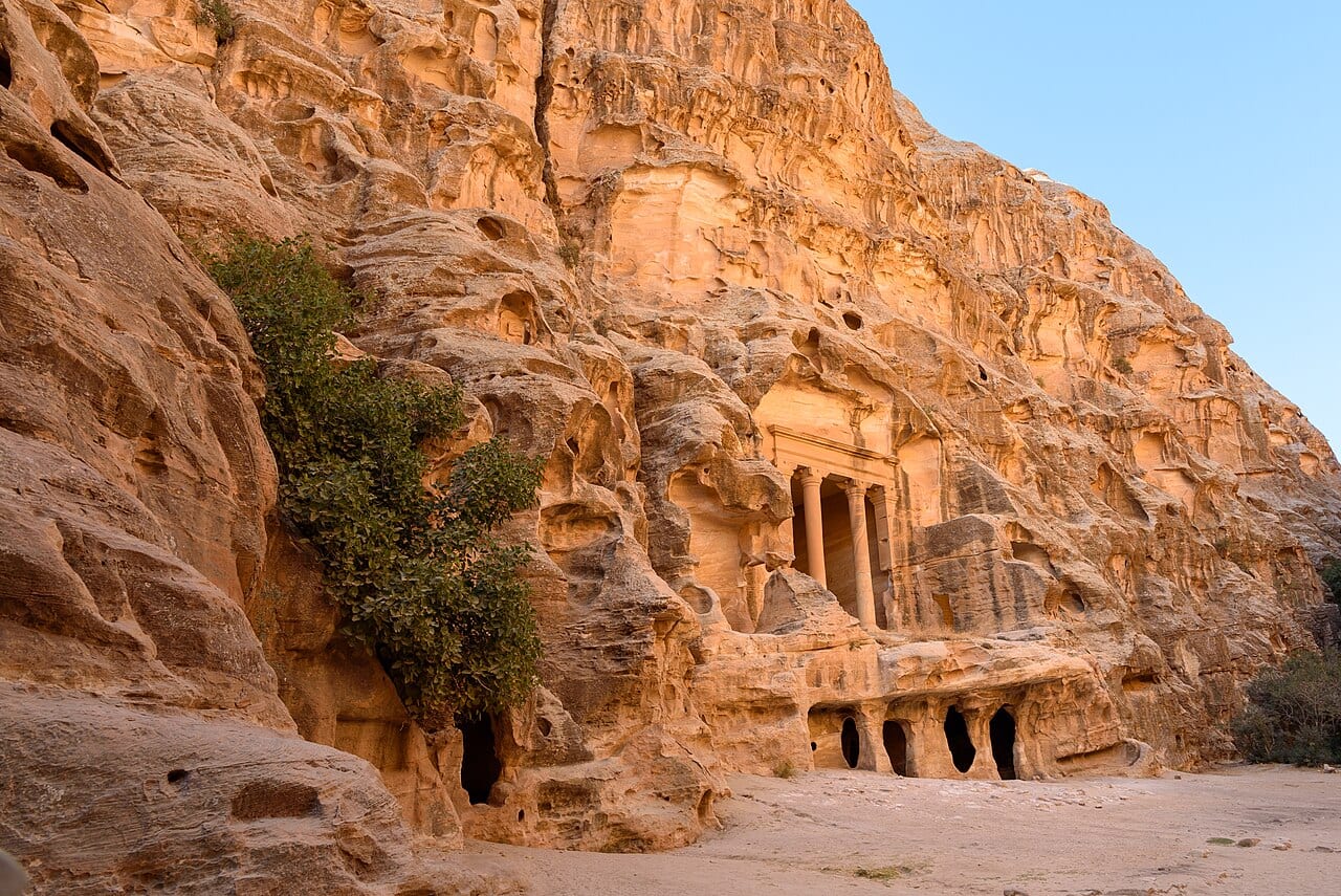 A carved columned facade in the sandstone canyon of Little Petra