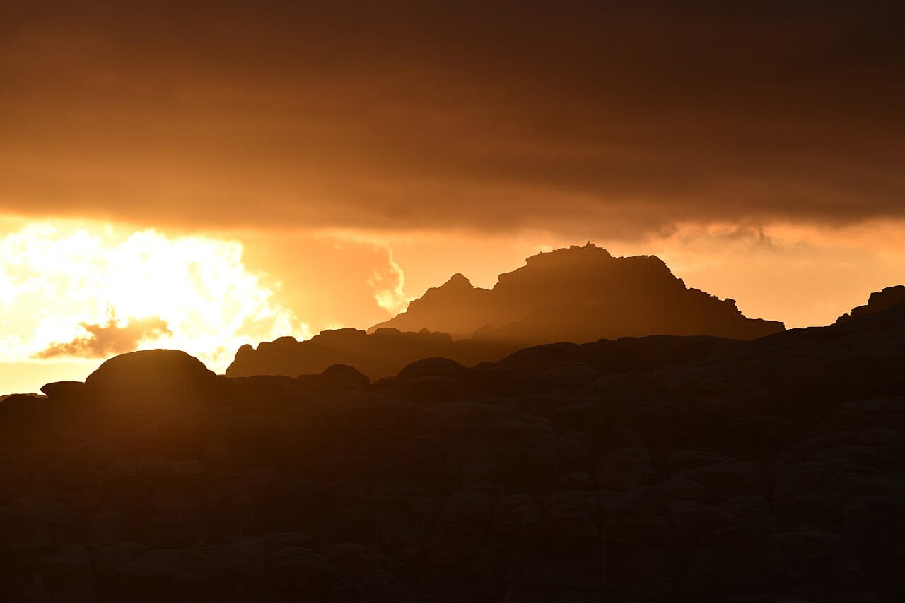 Sunset behind Jabal Haroun, with the shrine of Prophet Harun on the summit, seen from Wadi Musa