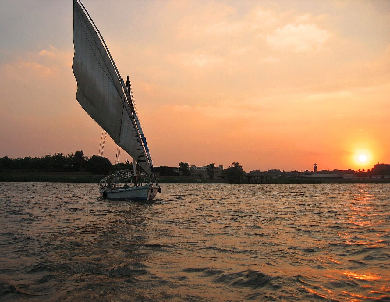 A felucca sailing on the Nile at sunset in Cairo