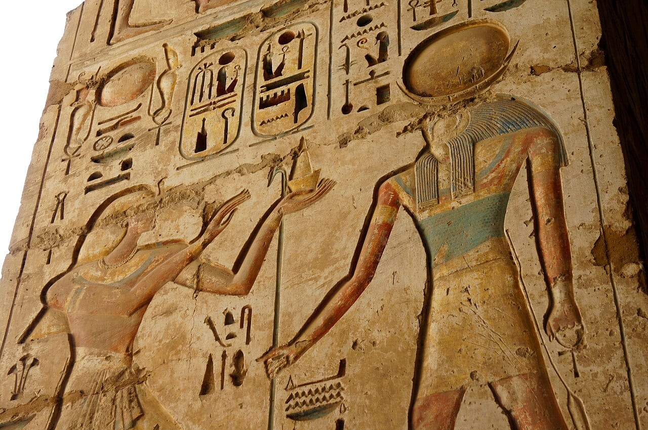 Painted relief of gods on the walls of Medinet Habu