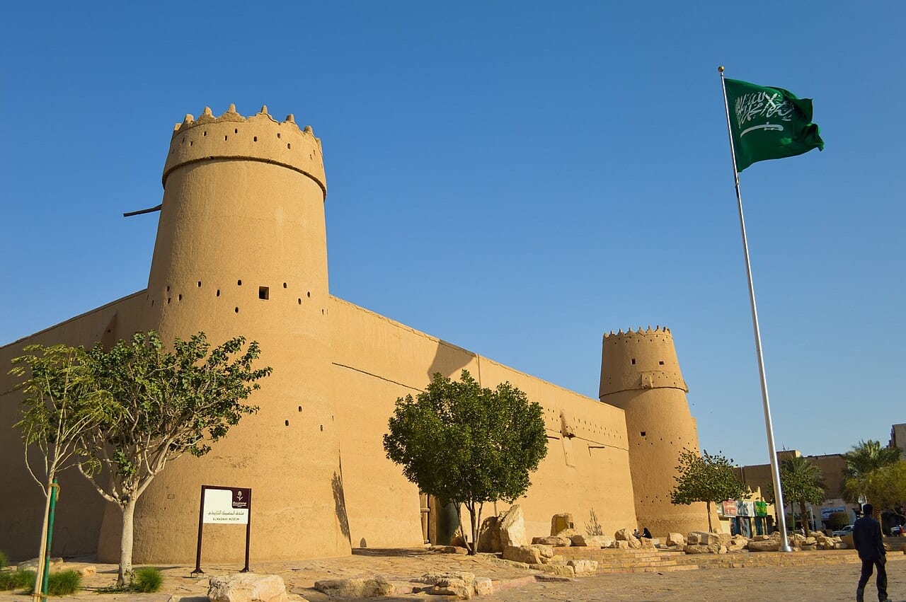 Masmak Fort in Riyadh with the Saudi flag flying above its mud-brick walls