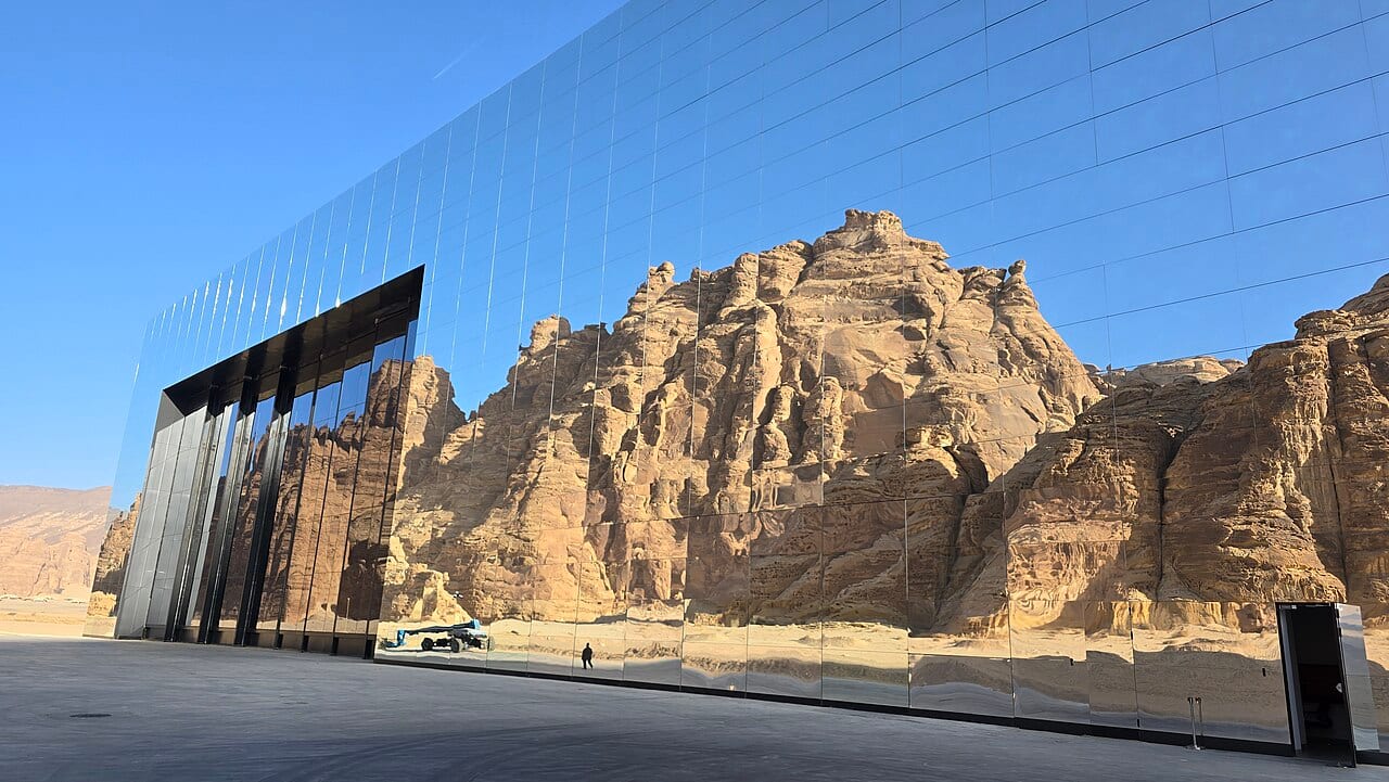 The mirrored walls of Maraya reflecting the desert cliffs of Ashar Valley
