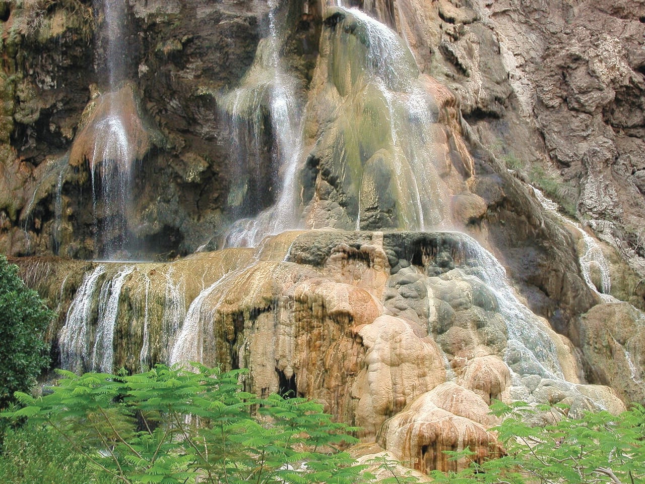 A mineral-stained waterfall at the Ma'in hot springs in the hills above the Dead Sea