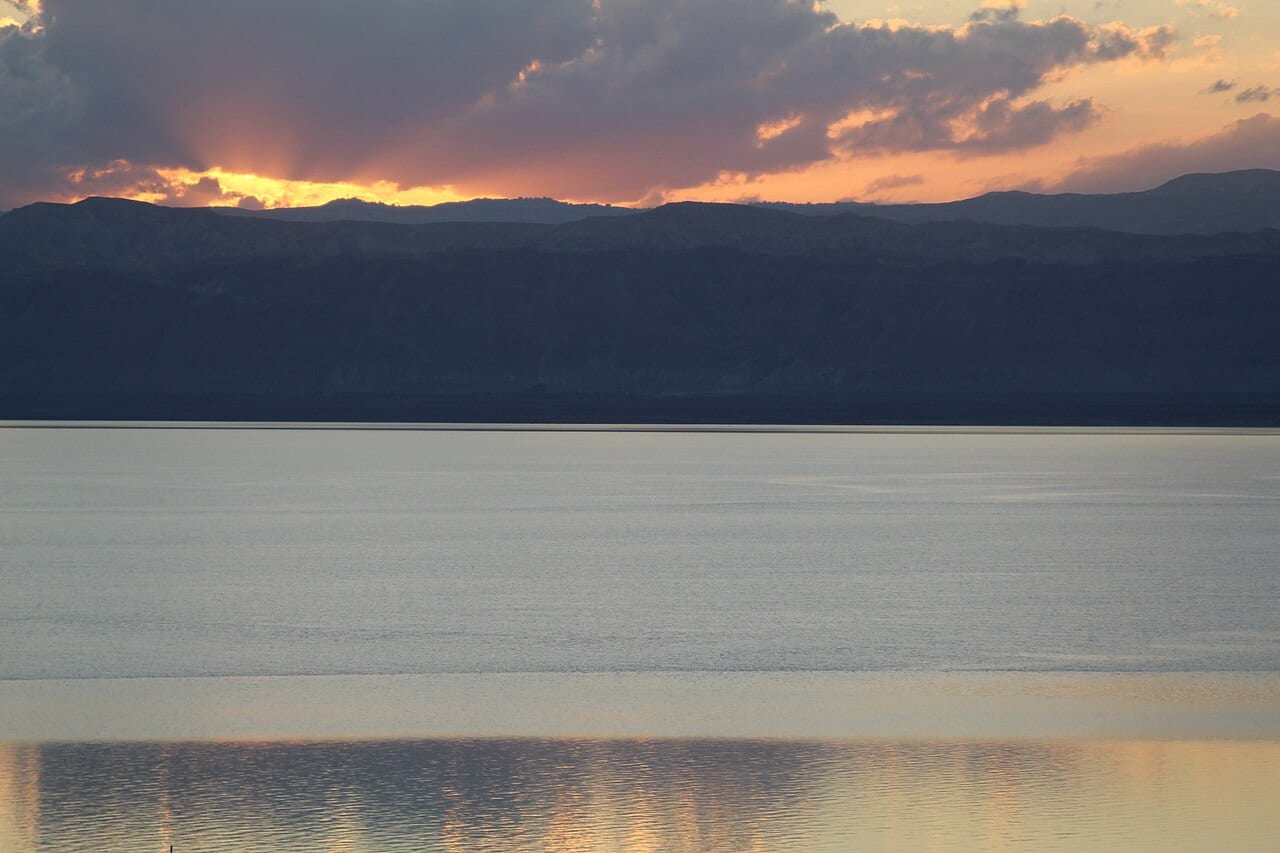 The sun setting over the Dead Sea and the hills of Palestine, seen from Jordan