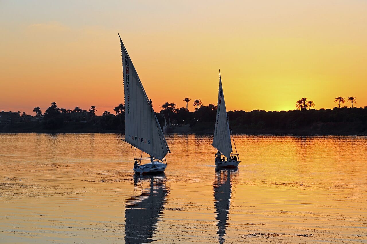 Felucca sailboats on the Nile at sunset in Luxor