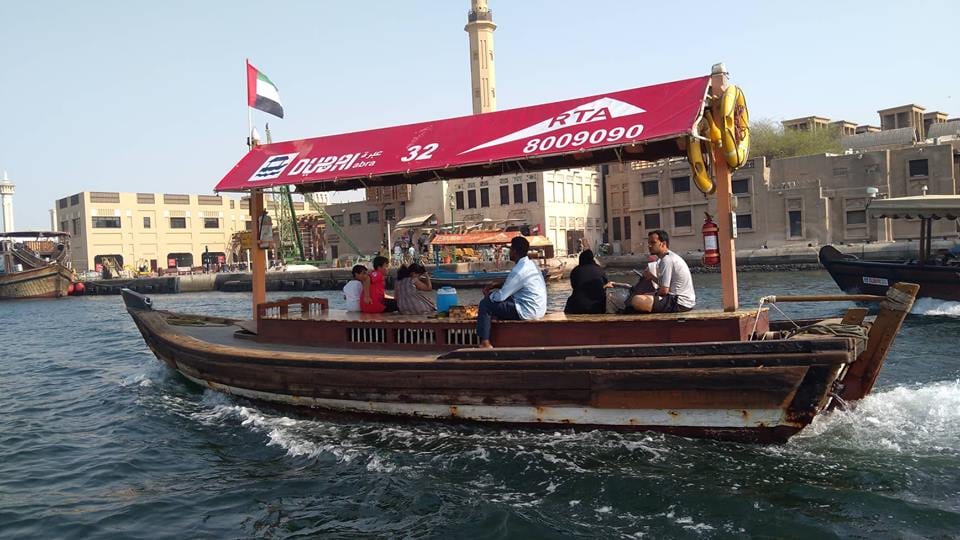 A traditional wooden abra ferry crossing Dubai Creek between Deira and Bur Dubai