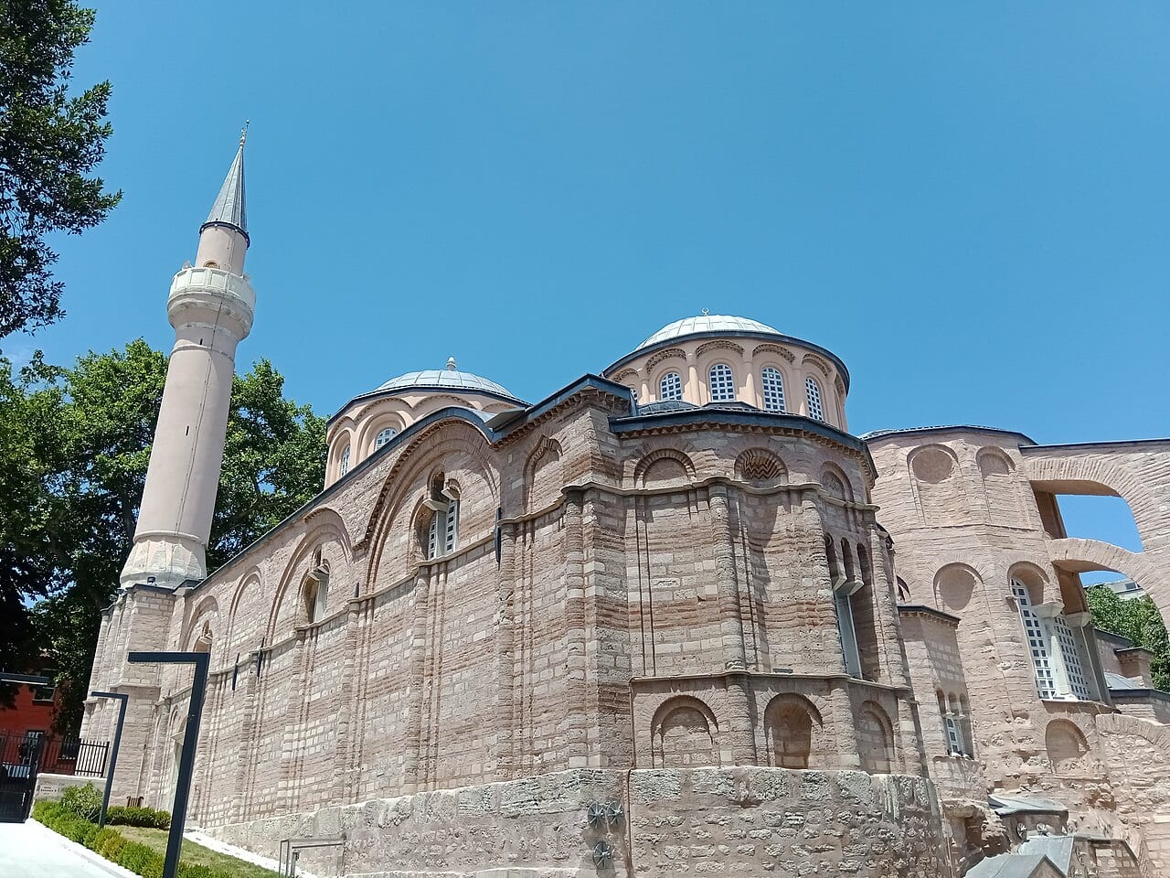 The brick domes and minaret of the Kariye Mosque near the old city walls