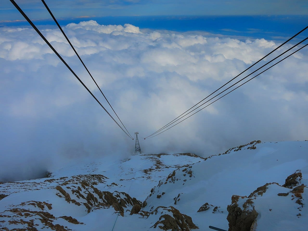 The Olympos cable car rising above the clouds on Tahtalı mountain